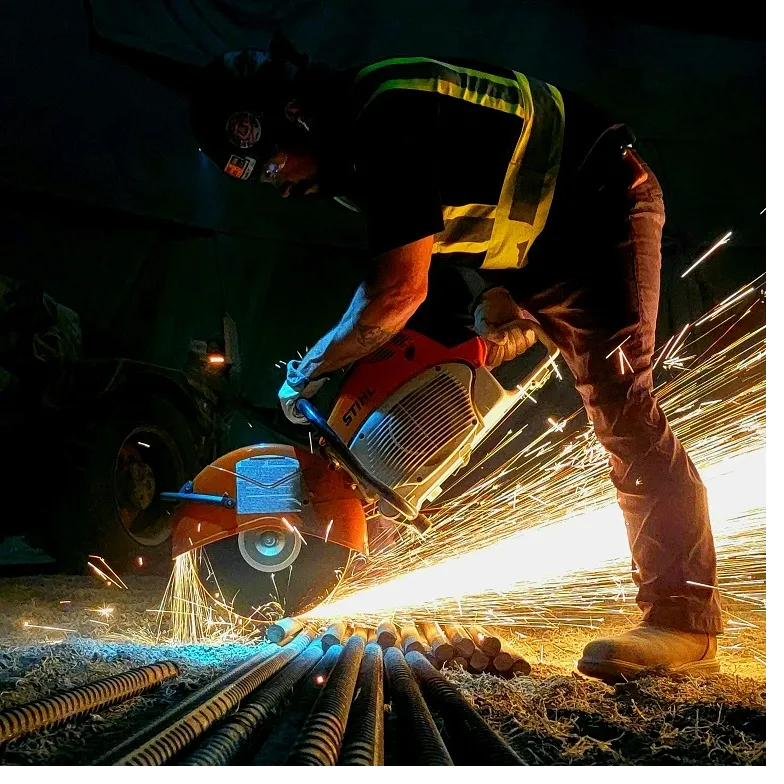 Kelly cutting rebar on a jobsite